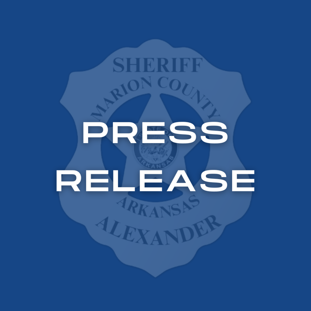 Blue box with badge logo and words Press Release