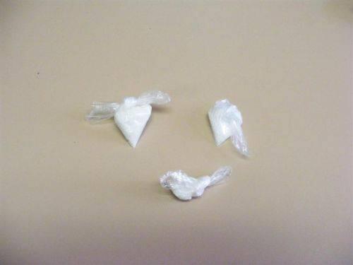 Three small bags of an unknown drug.