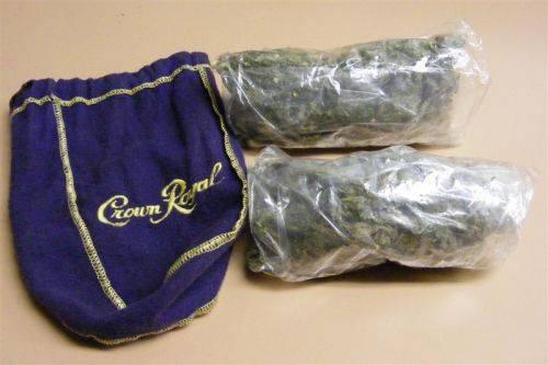 Two bags of marijuana next to a Crown Royal whiskey bag.