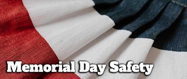 Red, white and blue background with words Memorial Day Safety